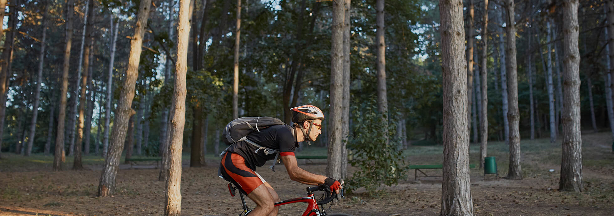 Man riding bike amongst trees