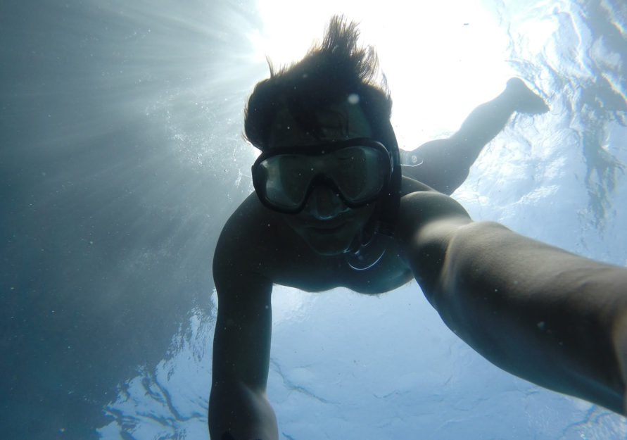 Man swimming under water