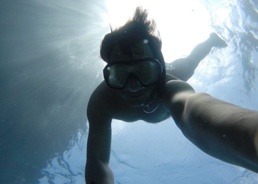 Man swimming under water